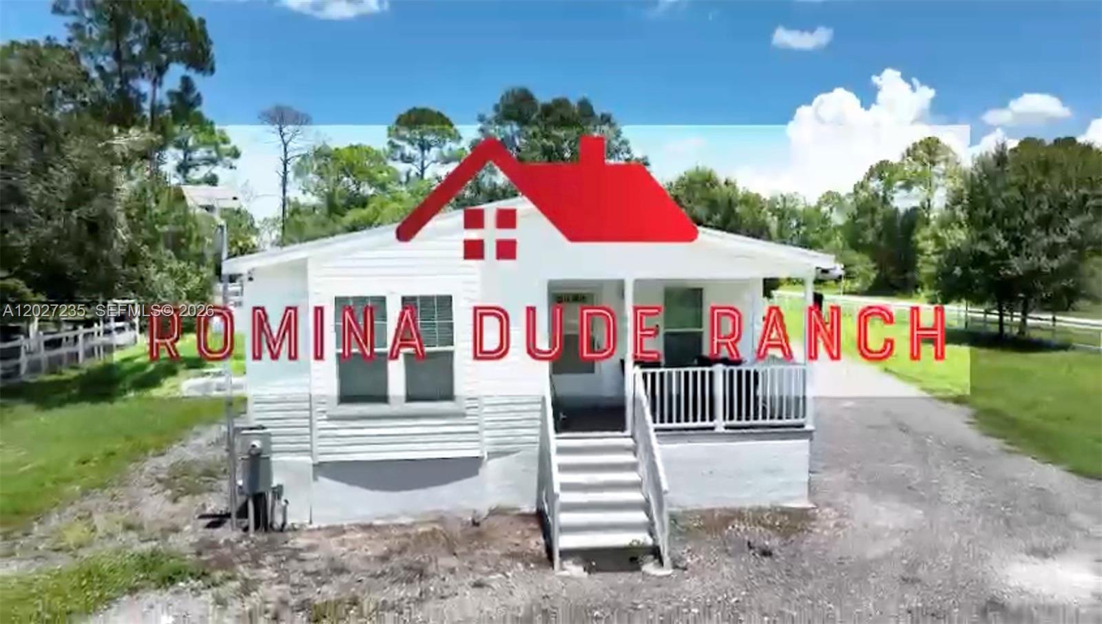 A white, single-story house with a front porch stands on a gravel lot — 725 N Willows St # 0, Clewiston FL 33440, CLEWISTON, FL