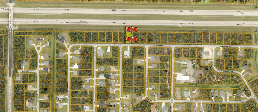 This is a map showing a vacant lot highlighted with red flags near a highway — LOFFREDA AVENUE, NORTH PORT, FL