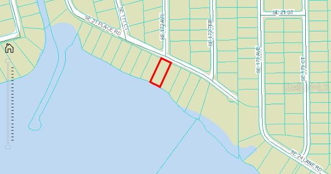 This is a map showing a rectangular parcel of land highlighted in red along a waterfront — SE 21ST PLACE ROAD, SILVER SPRINGS, FL