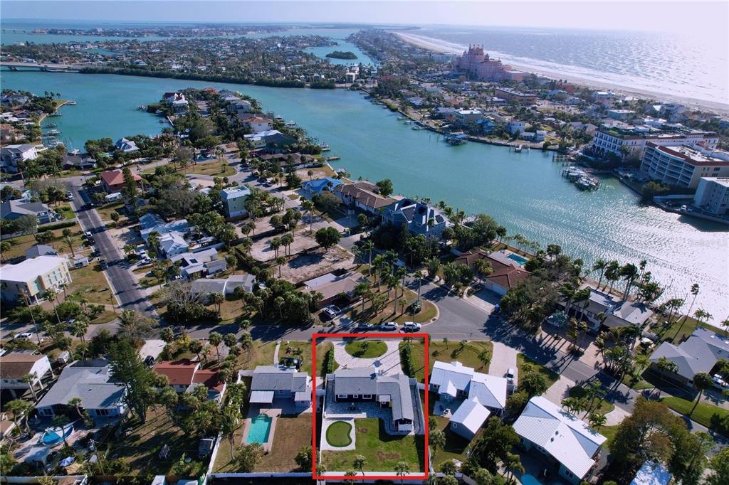 An aerial view shows a residential property outlined in red within a coastal neighborhood — 220 40TH AVENUE, ST PETE BEACH, FL
