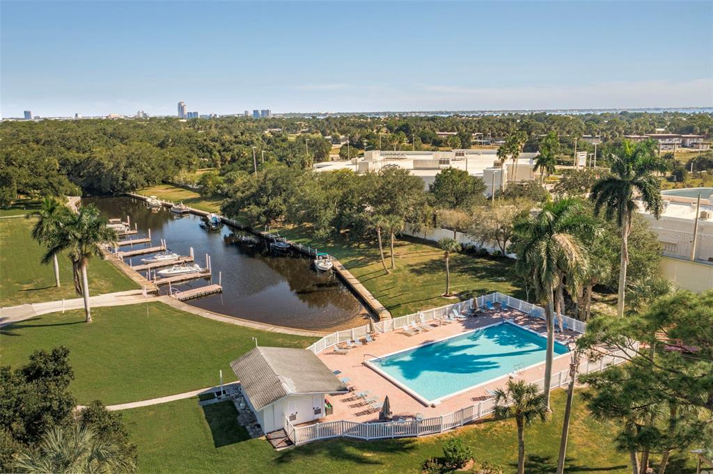 An aerial view shows a swimming pool, a small pool house, and a boat dock — 536 PANGOLA DRIVE, NORTH FORT MYERS, FL