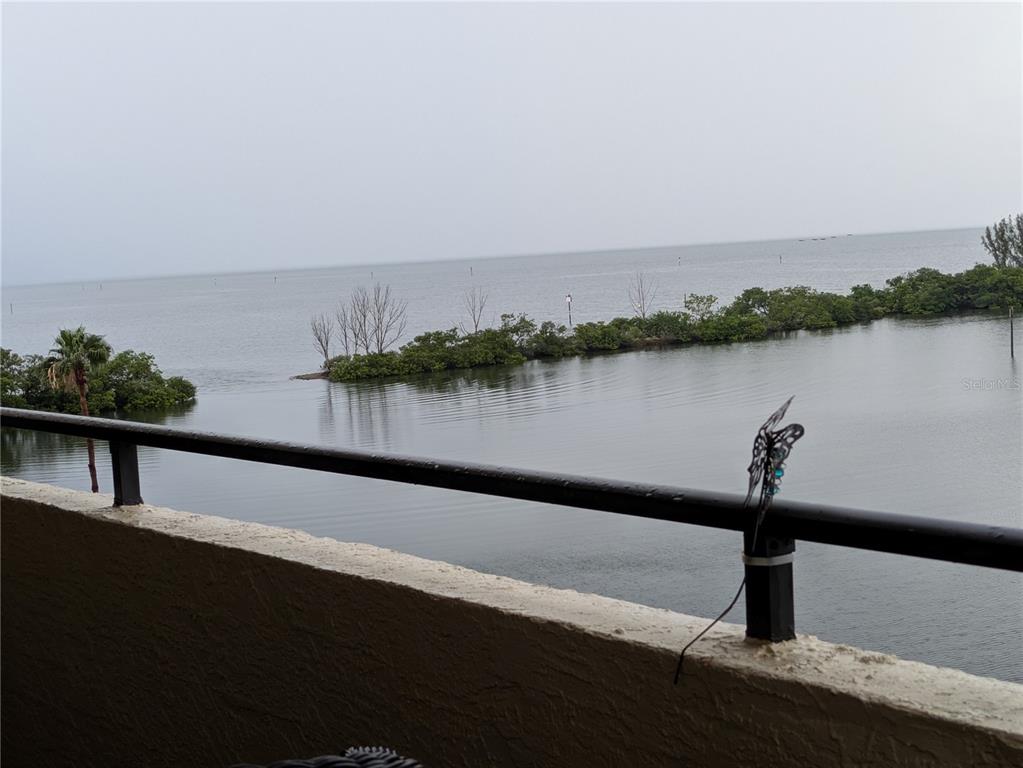 A view of a calm body of water and a mangrove island from a balcony — 5915 SEA RANCH DRIVE UNIT 404, HUDSON, FL