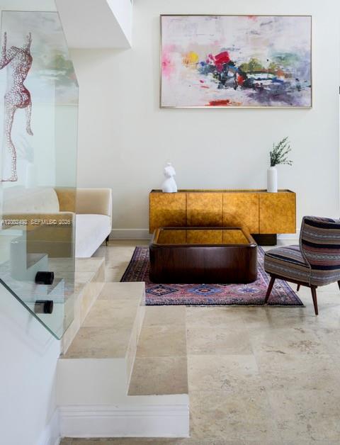 A living room features a gold sideboard, a dark coffee table, and a patterned armchair — 2766 SW 33rd Ave # 2766, Miami FL 33133, MIAMI, FL