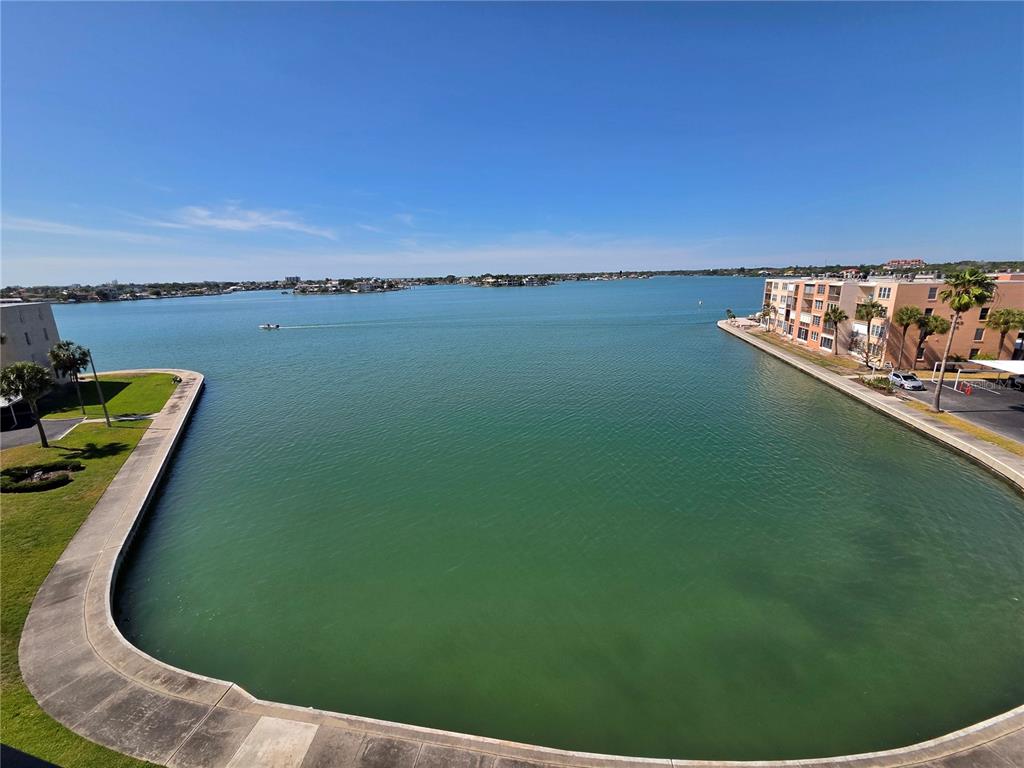A high-angle view of a calm bay surrounded by buildings and palm trees — 7700 SUN ISLAND DRIVE S UNIT 503, SOUTH PASADENA, FL