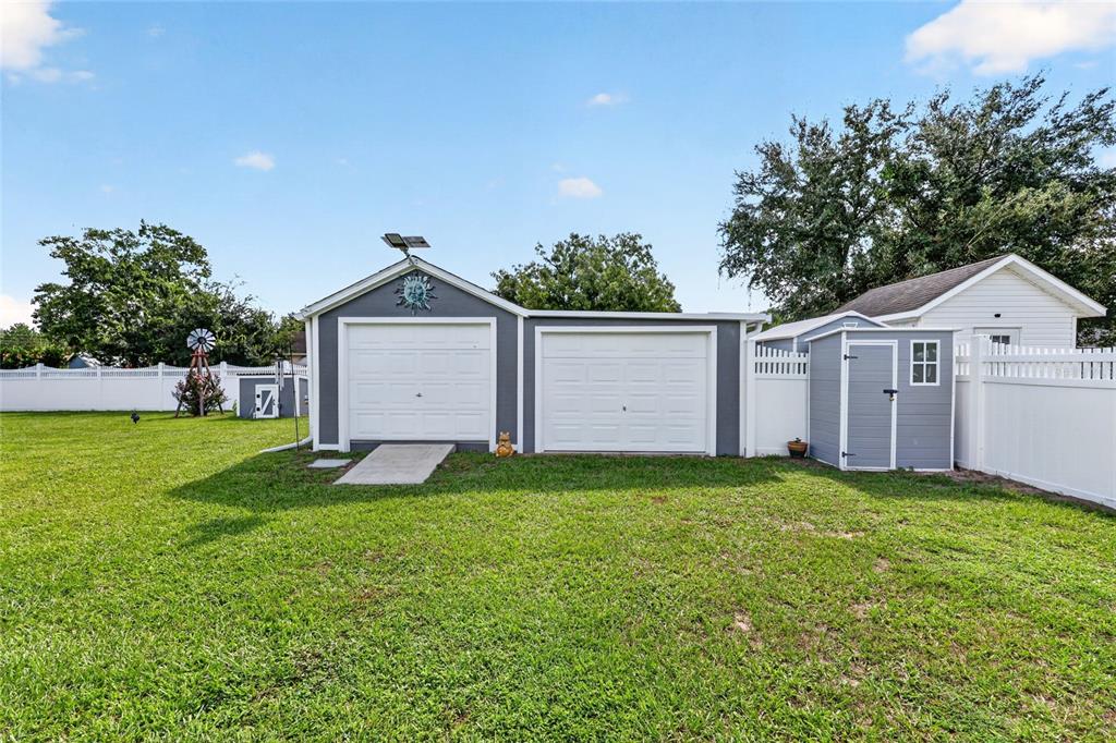 An entryway with tile flooring leads into a living area through an open front door — 11631 SE 84TH AVENUE, BELLEVIEW, FL