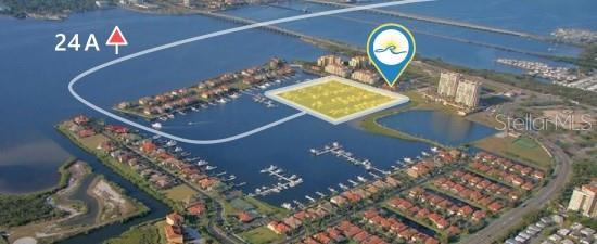 This aerial rendering shows a waterfront residential community with a highlighted vacant lot and marina — 102 RIVIERA DUNES WAY UNIT S-88, PALMETTO, FL