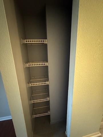 A narrow closet features five white wire shelves installed against a dark gray back wall — 4384 NW 9th Avenue # 2f, Pompano Beach FL 33064, POMPANO BEACH, FL