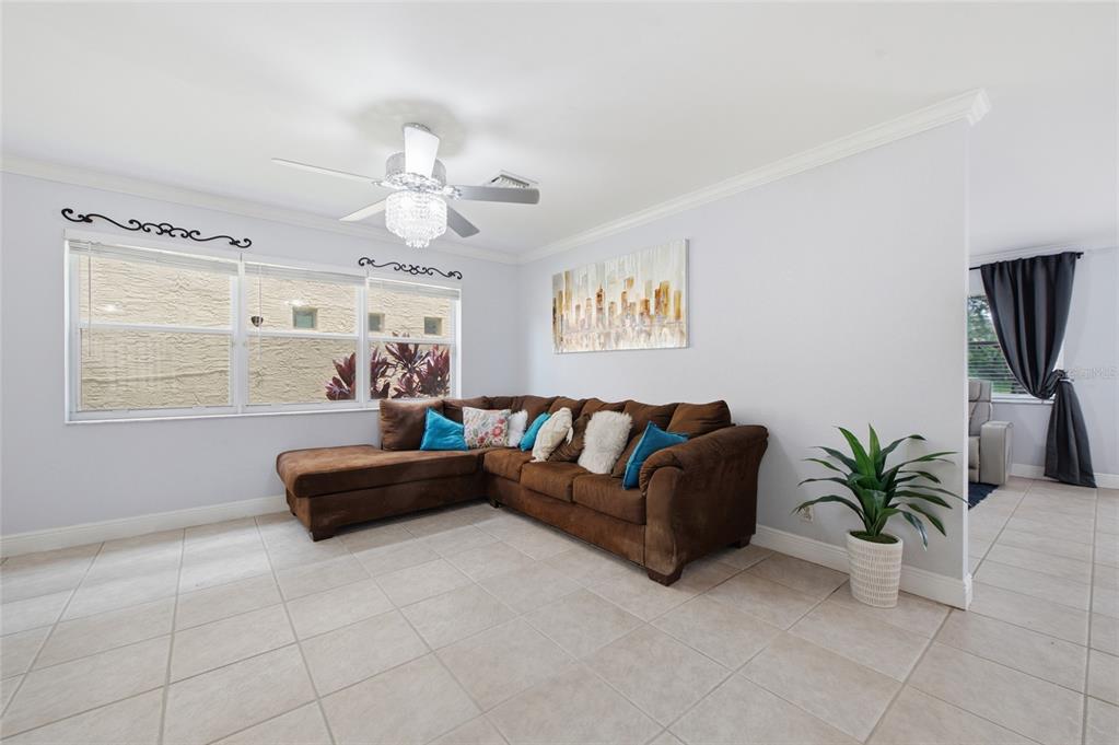 A two-story house with a tan stucco exterior, red tile roof, and a front garage — 4258 NW 1ST DR, DEERFIELD BEACH, FL