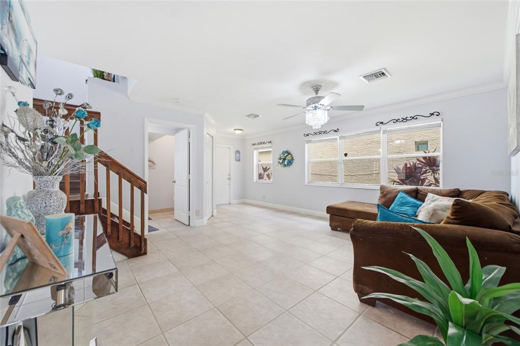 A covered entryway with a white front door and a concrete walkway — 4258 NW 1ST DR, DEERFIELD BEACH, FL