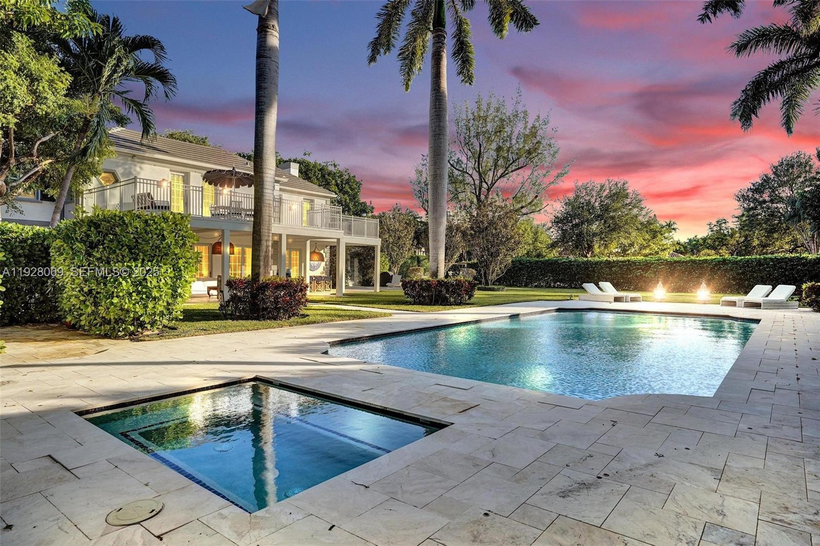 A backyard features a swimming pool, a spa, palm trees, and a two-story house — 1281 Banyan Rd, Boca Raton FL 33432, BOCA RATON, FL