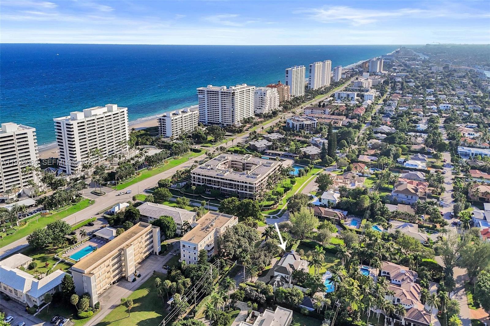 An aerial view shows a coastal neighborhood with high-rise buildings and a marked residential house — 1281 Banyan Rd, Boca Raton FL 33432, BOCA RATON, FL
