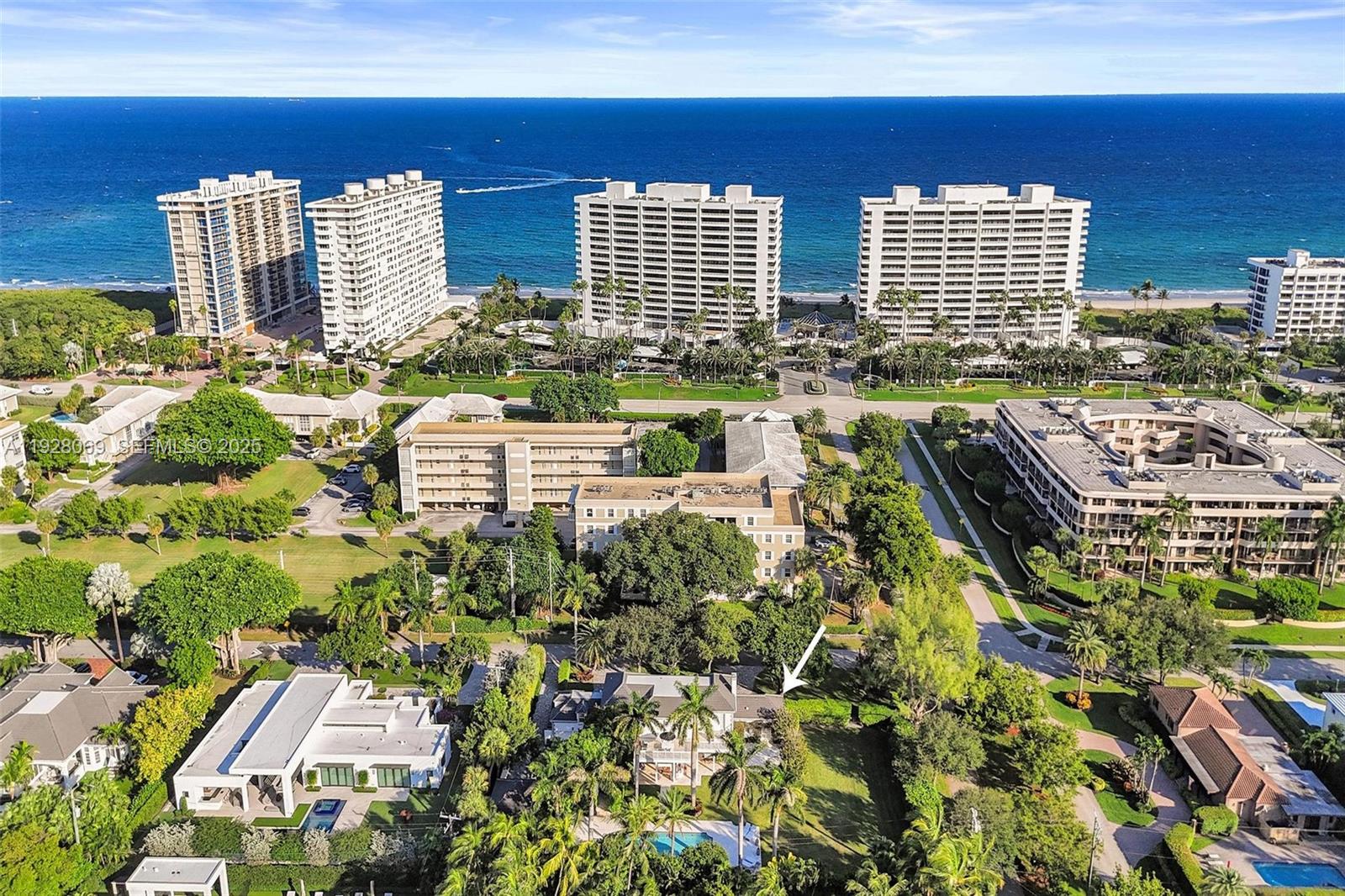 An aerial view shows a residential property with a swimming pool near beachfront high-rise buildings — 1281 Banyan Rd, Boca Raton FL 33432, BOCA RATON, FL