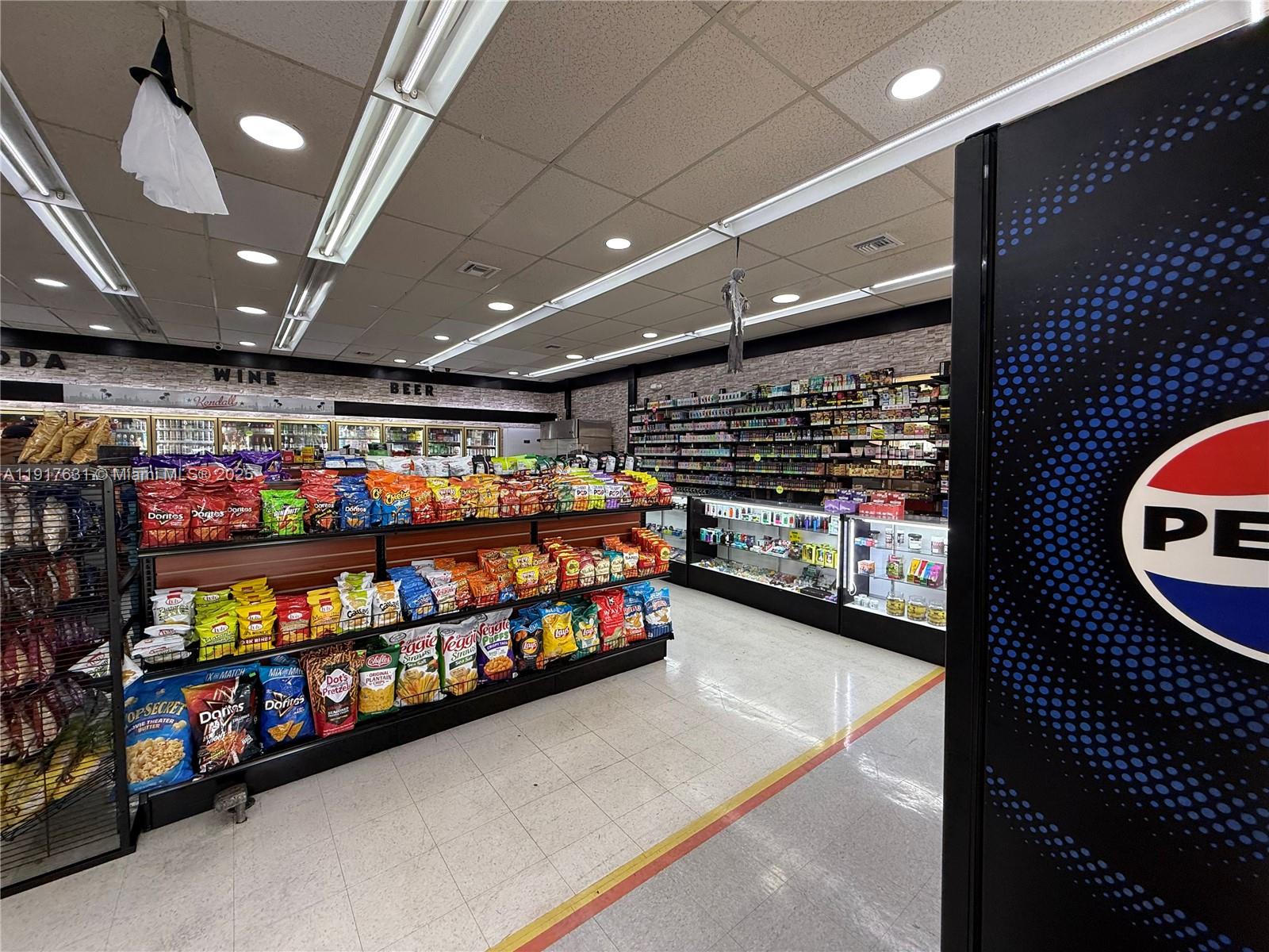 A convenience store interior features snack aisles, a glass display counter, and a Pepsi cooler — 9510 SW 137TH AVE, Miami FL 33186, MIAMI, FL