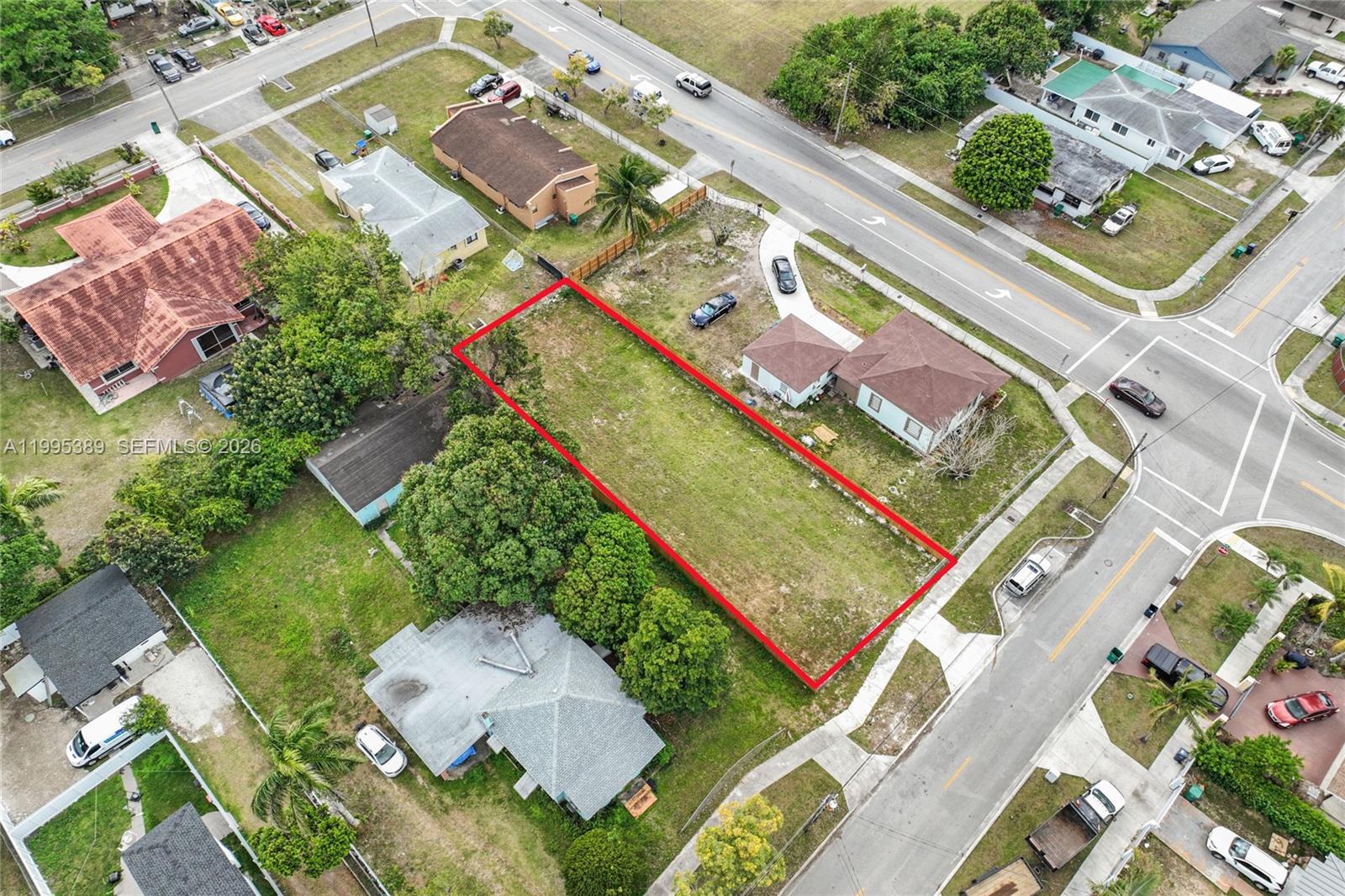 An aerial view shows a vacant rectangular lot outlined in red between two houses — nw 2, Florida City FL 33034, FLORIDA CITY, FL