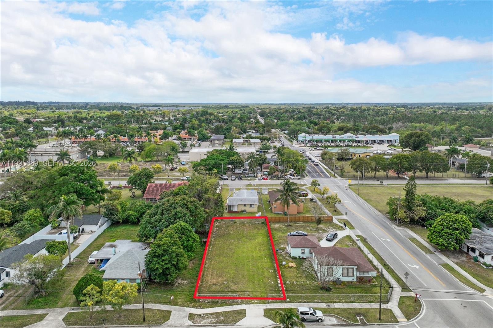 An aerial view shows a vacant rectangular lot outlined in red within a residential neighborhood — nw 2, Florida City FL 33034, FLORIDA CITY, FL