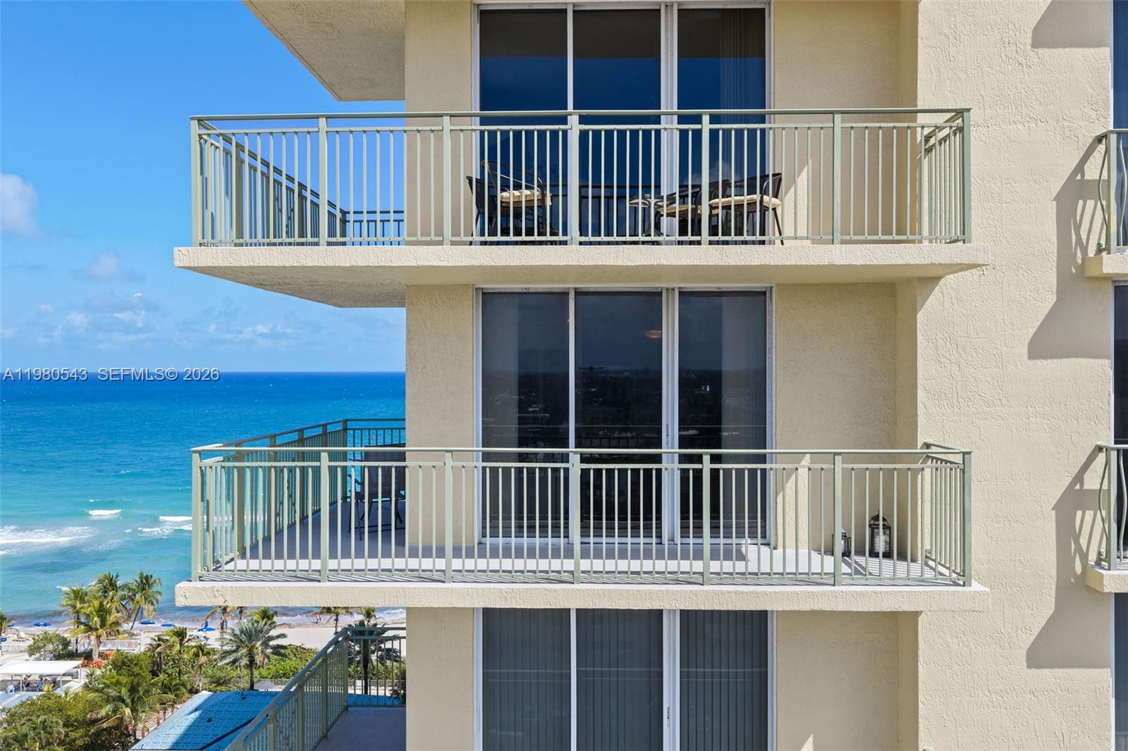 A multi-story building exterior features stacked balconies overlooking the ocean and beach — 2080 S Ocean Dr # 1402, Hallandale Beach FL 33009, HALLANDALE BEACH, FL