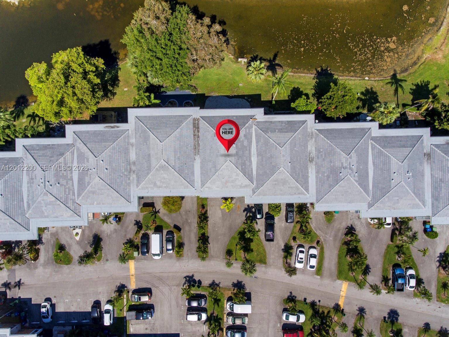 This aerial view shows a multi-unit residential building with a gray tiled roof — 6795 Brookline Dr # 6795, Miami FL 33015, MIAMI, FL
