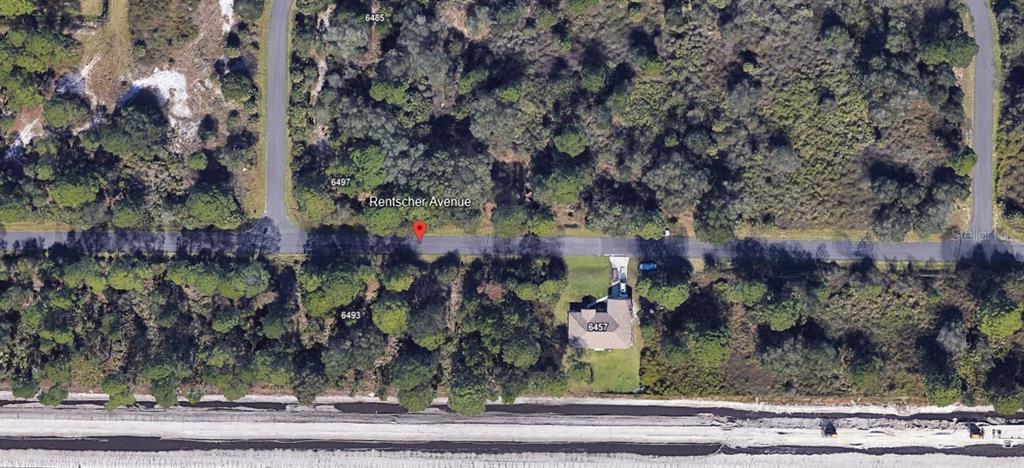 This is an aerial map view showing a residential street with wooded lots and a house — RENTSCHER AVENUE, NORTH PORT, FL