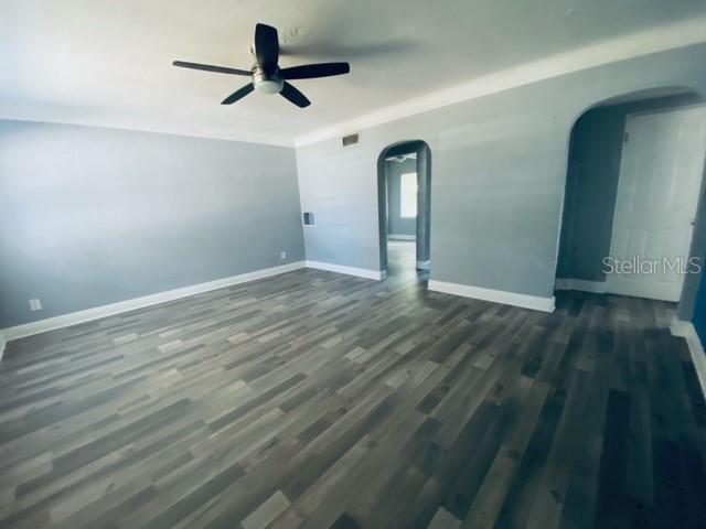 An empty room with gray walls, wood-look flooring, and a ceiling fan — 2510 14TH STREET S, ST PETERSBURG, FL