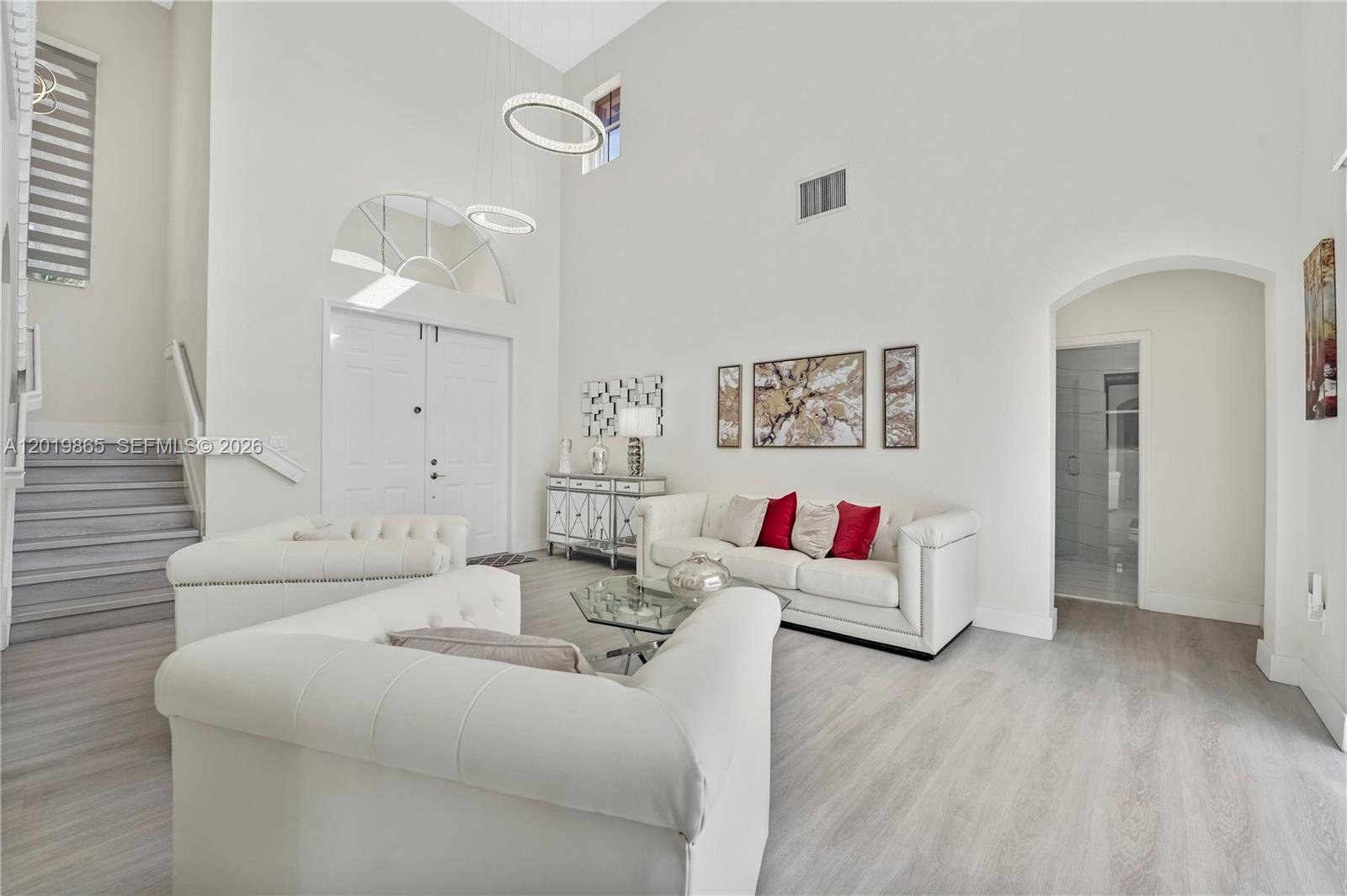 The front entrance features a paved walkway leading to double doors under a stone archway — 15632 NW 79th Ct, Miami Lakes FL 33016, MIAMI LAKES, FL