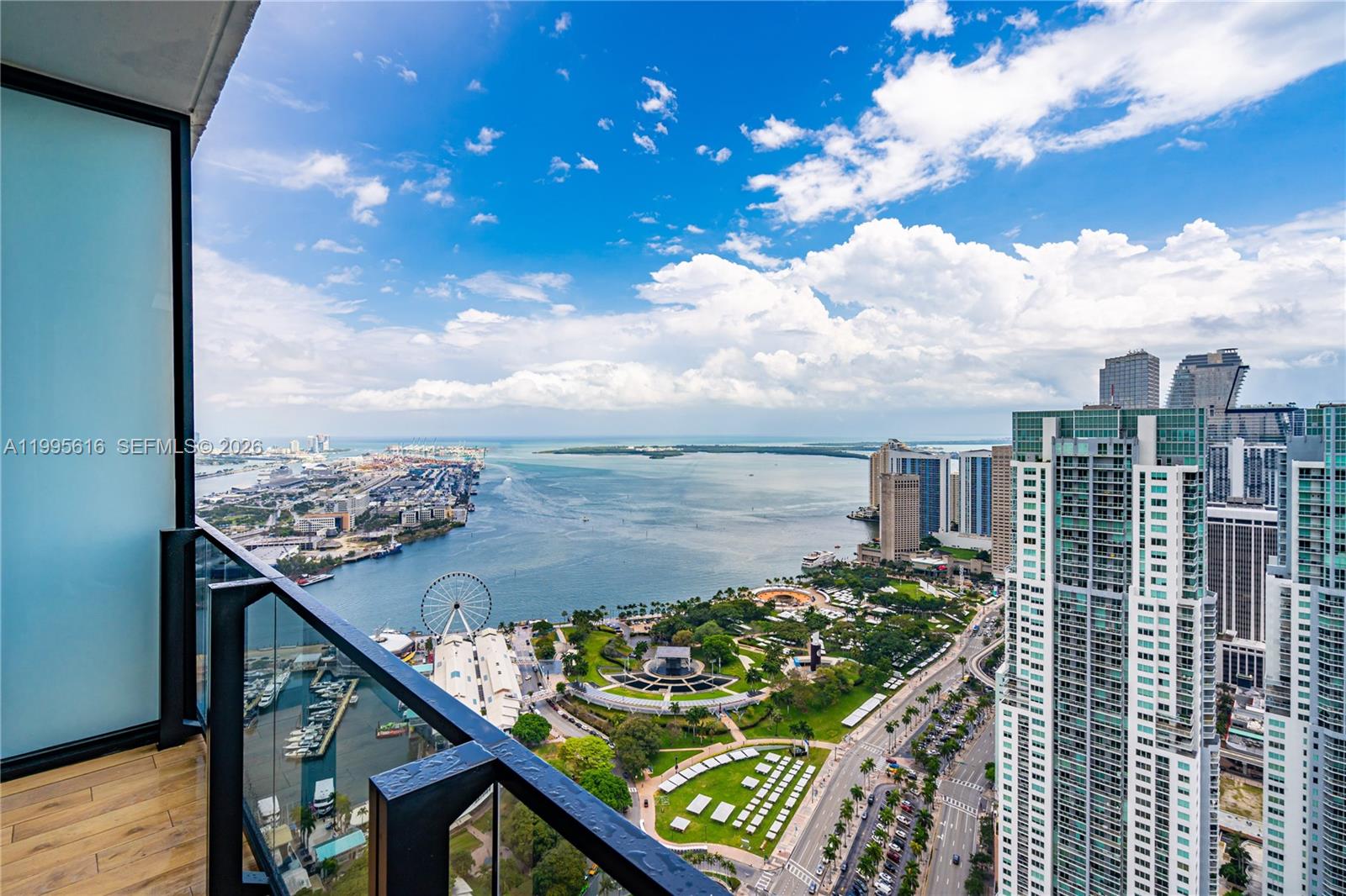 A high-rise balcony overlooks a city park, a harbor, and the Miami skyline — 398 NE 5th St # 4412, Miami FL 33132, MIAMI, FL
