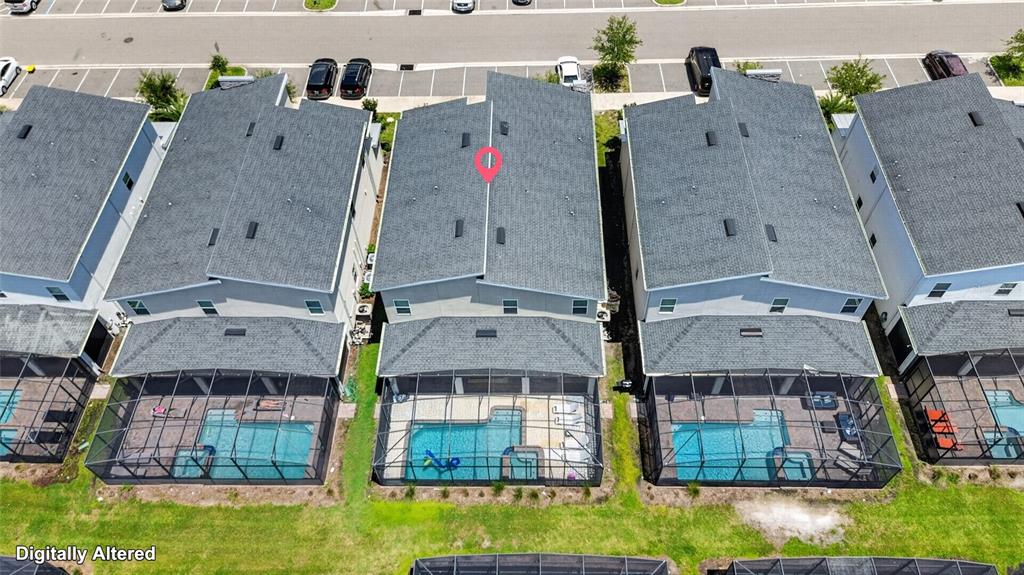 An aerial view shows three townhouses with screened-in pools and a shared parking lot — 4536 TARGET BOULEVARD, KISSIMMEE, FL
