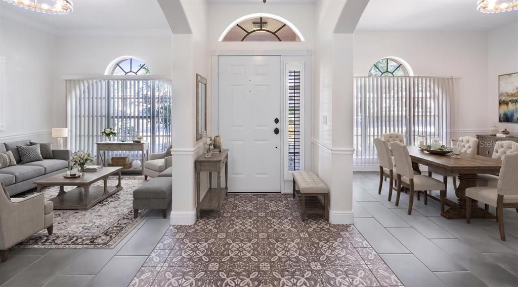 An entryway with patterned tile flooring leads to a living room and dining area — 2241 KINGSMILL WAY, CLERMONT, FL
