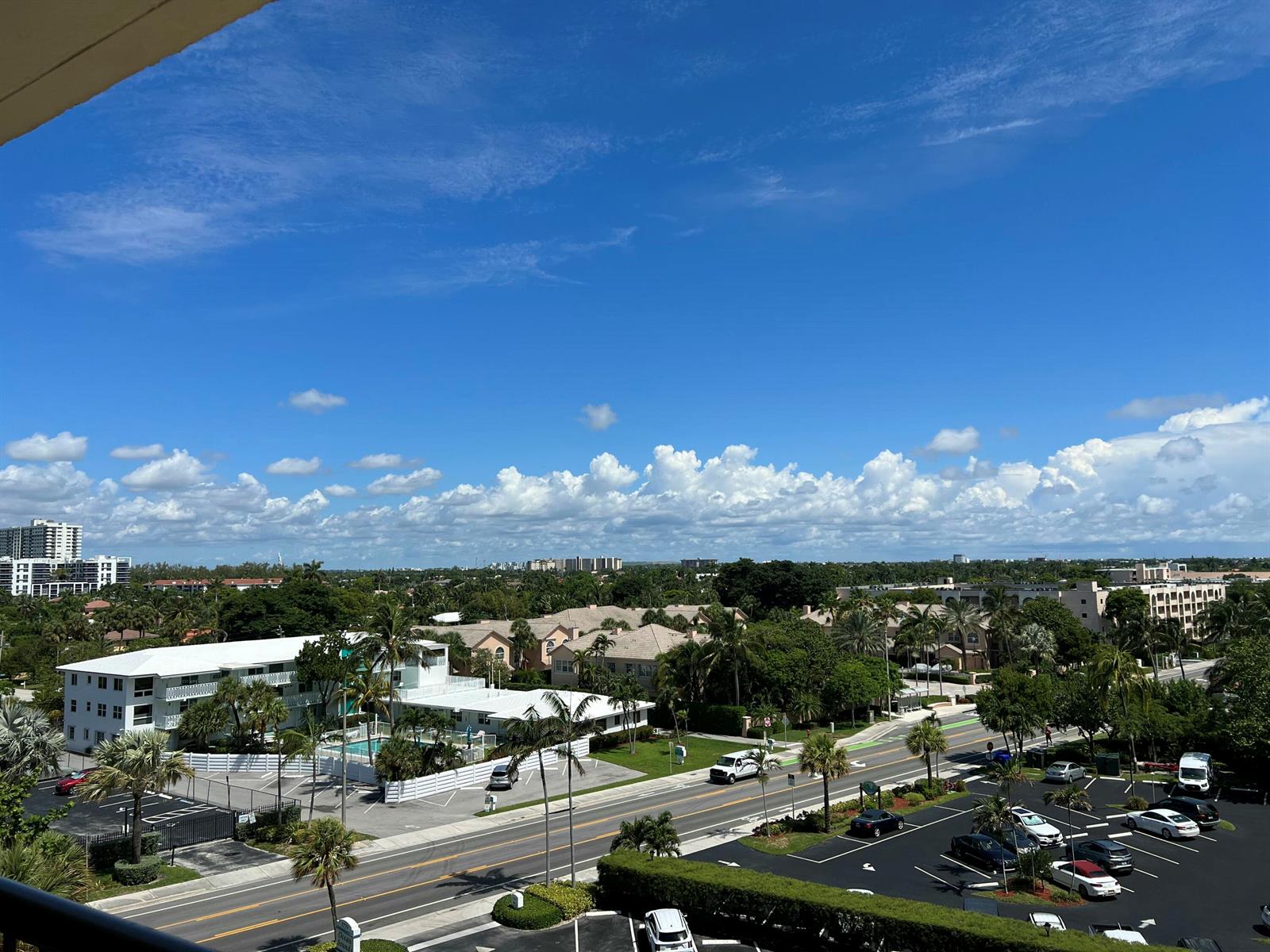 An elevated view shows a street, parking lot, and residential buildings under a blue sky — 1800 S Ocean Boulevard Unit 612, Pompano Beach FL 33062, POMPANO BEACH, FL