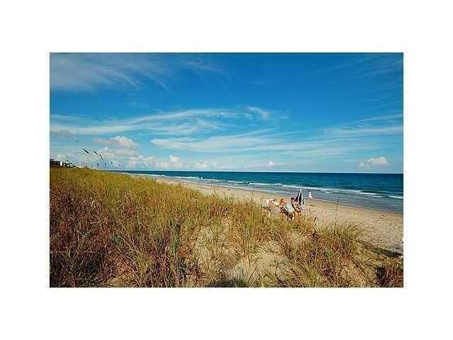 A sandy beach with tall dune grass, a blue ocean, and a clear sky — 2871 N Ocean Boulevard N # V345, Boca Raton FL 33431, BOCA RATON, FL