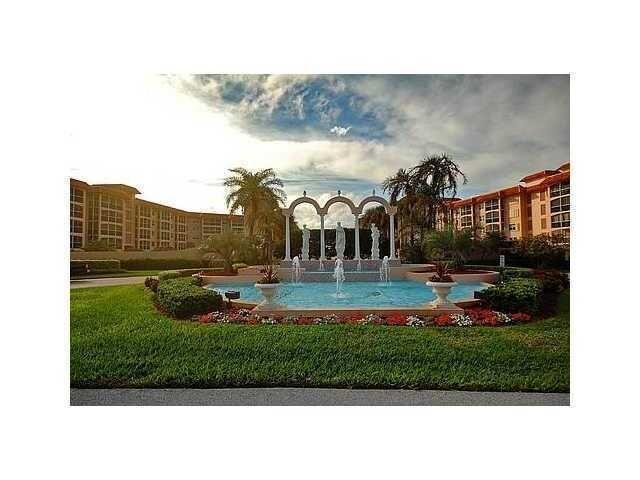 A large outdoor fountain with statues and arches sits in front of a residential complex — 2871 N Ocean Boulevard N # V345, Boca Raton FL 33431, BOCA RATON, FL
