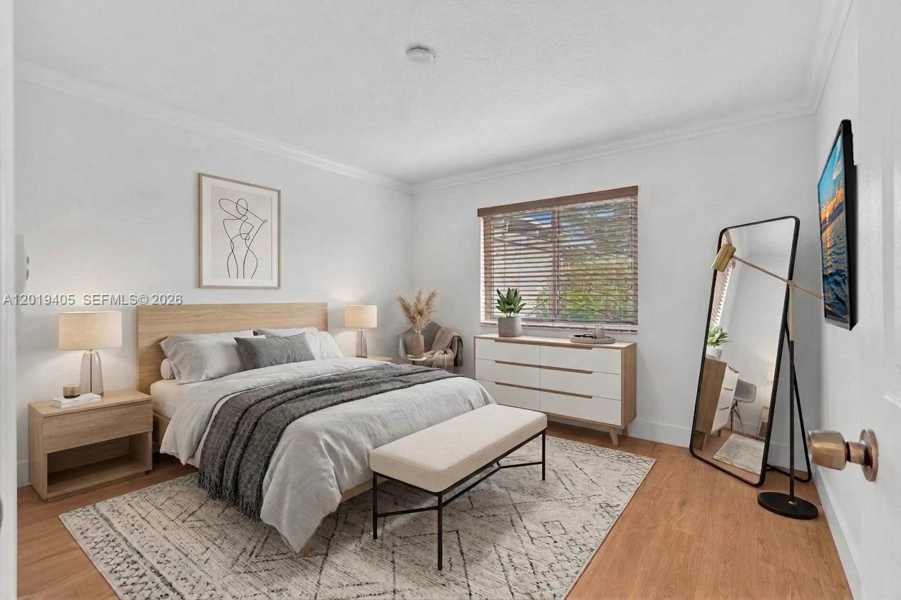 A bedroom features a bed with a wooden headboard, a dresser, and a floor mirror — 14898 Wildflower Ln, Delray Beach FL 33446, DELRAY BEACH, FL