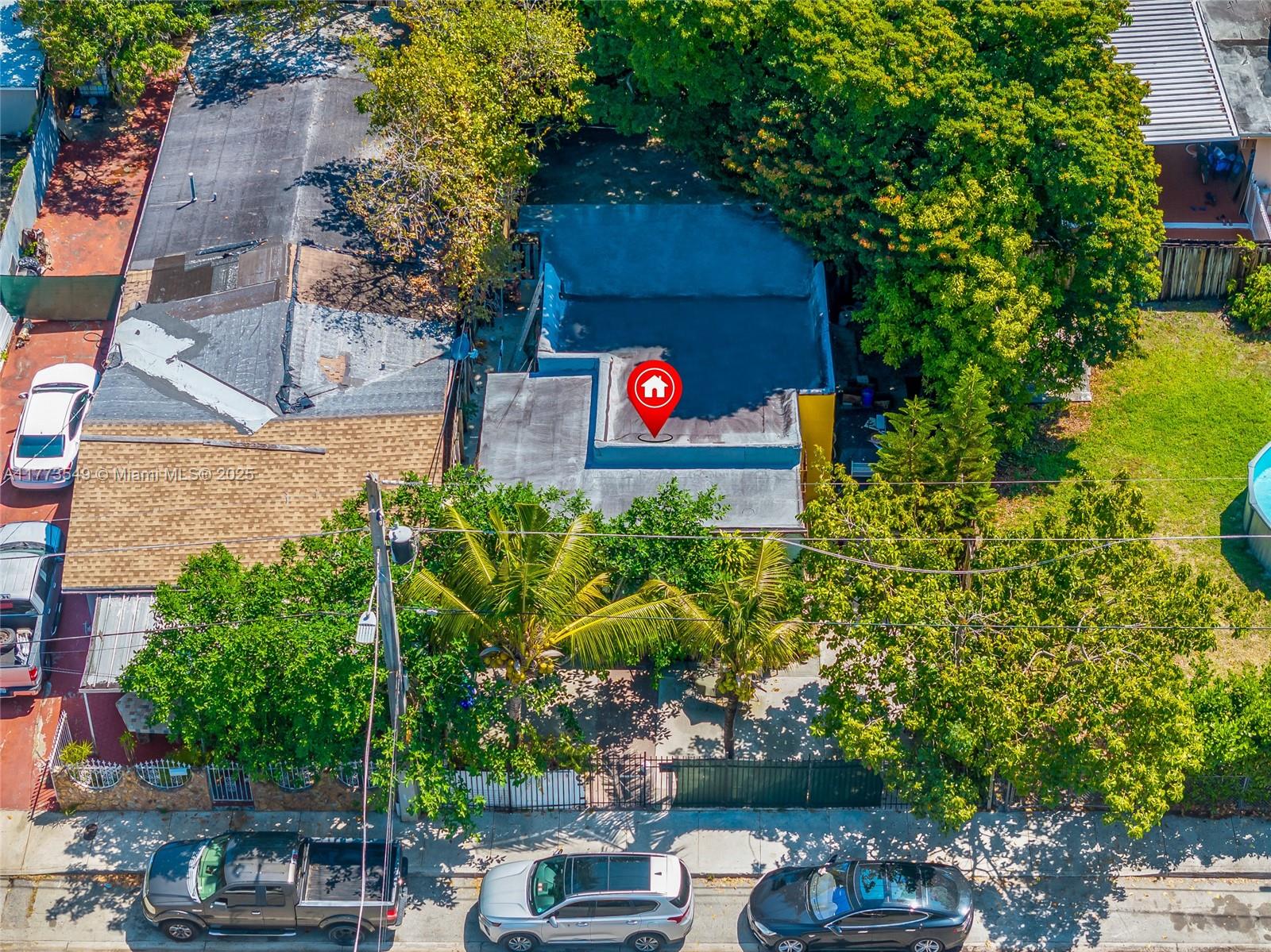An aerial view shows a flat-roofed house with a red location pin on its roof — 3123 NW 3rd Ave, Miami FL 33127, MIAMI, FL