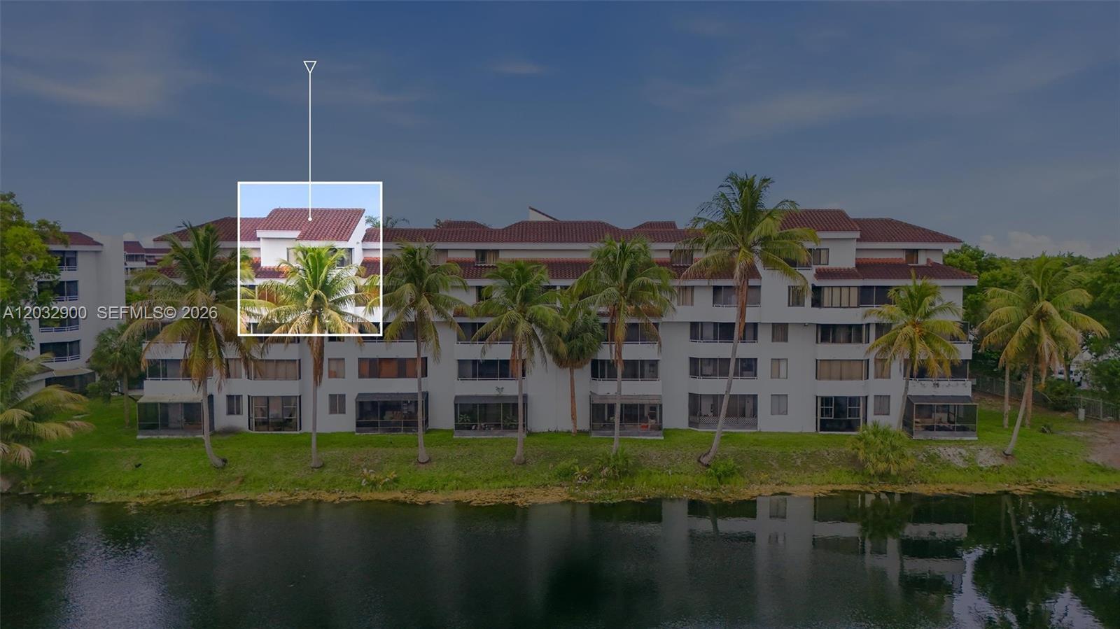 An exterior view of a multi-story apartment building with a red tile roof — 8335 SW 152nd Ave # 411, Miami FL 33193, MIAMI, FL