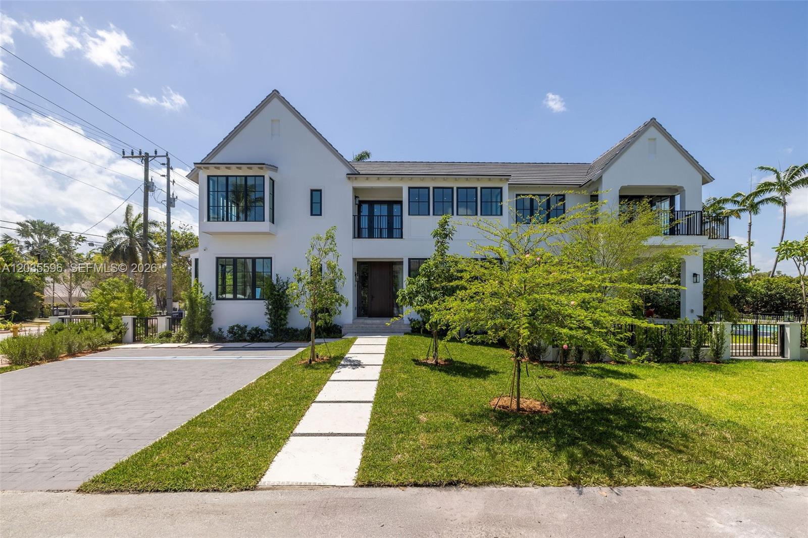 A two-story white house with a paved driveway and a front walkway — 5262 La Gorce Dr, Miami Beach FL 33140, MIAMI BEACH, FL