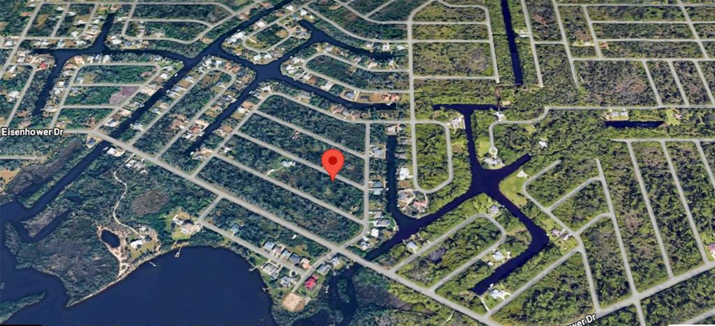 This is an aerial map view of a residential lot surrounded by canals and vegetation — 12349 TOYNBEE LANE, PORT CHARLOTTE, FL