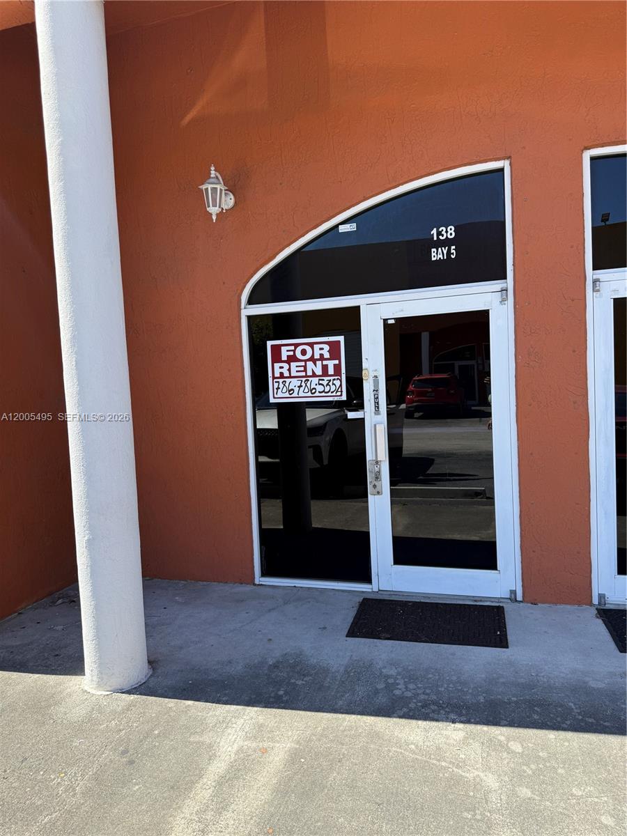 A commercial storefront entrance features a glass door with a for rent sign — 2980 W 82th St # 5, Hialeah FL 33018, HIALEAH, FL