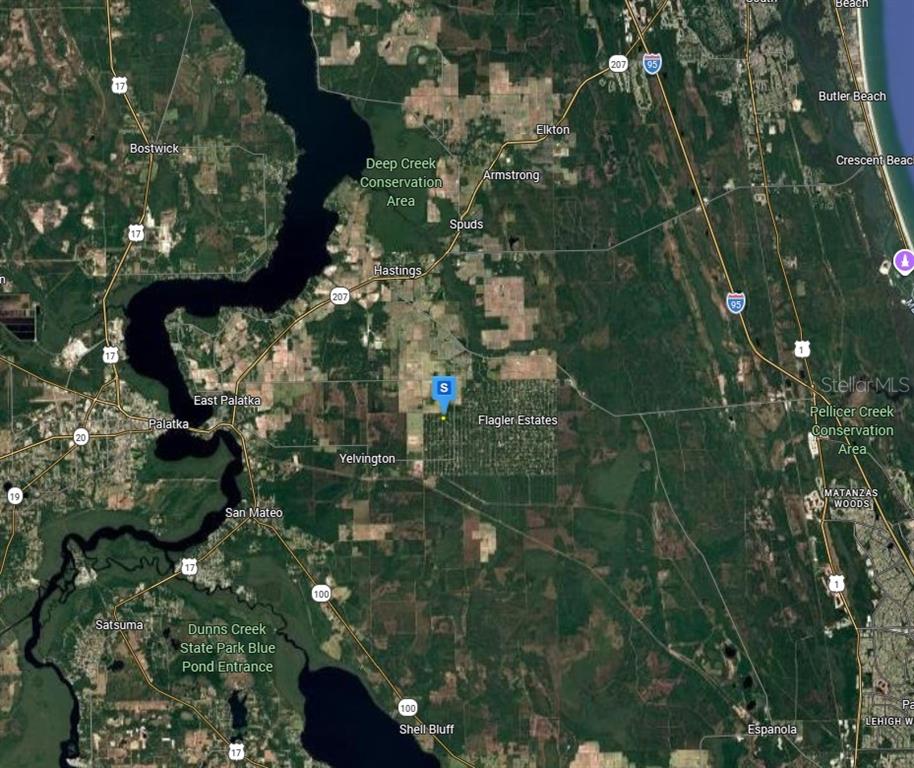 This is a satellite map showing the area surrounding Flagler Estates and the St. Johns River — 10030 DELGADO AVENUE, HASTINGS, FL