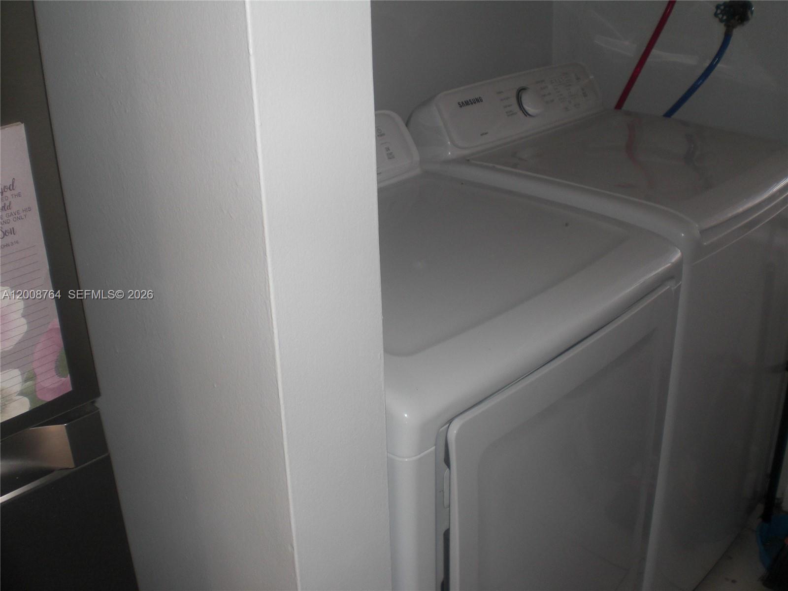 A white Samsung washing machine and dryer are positioned in a small laundry closet — 962 NW 79th Ter, Plantation FL 33324, PLANTATION, FL