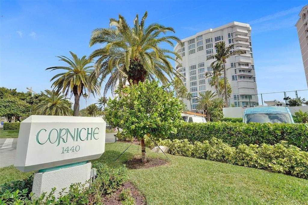 A sign for the Corniche stands in front of a tall residential building and palm trees — 1440 S Ocean Boulevard # c, Pompano Beach FL 33062, POMPANO BEACH, FL