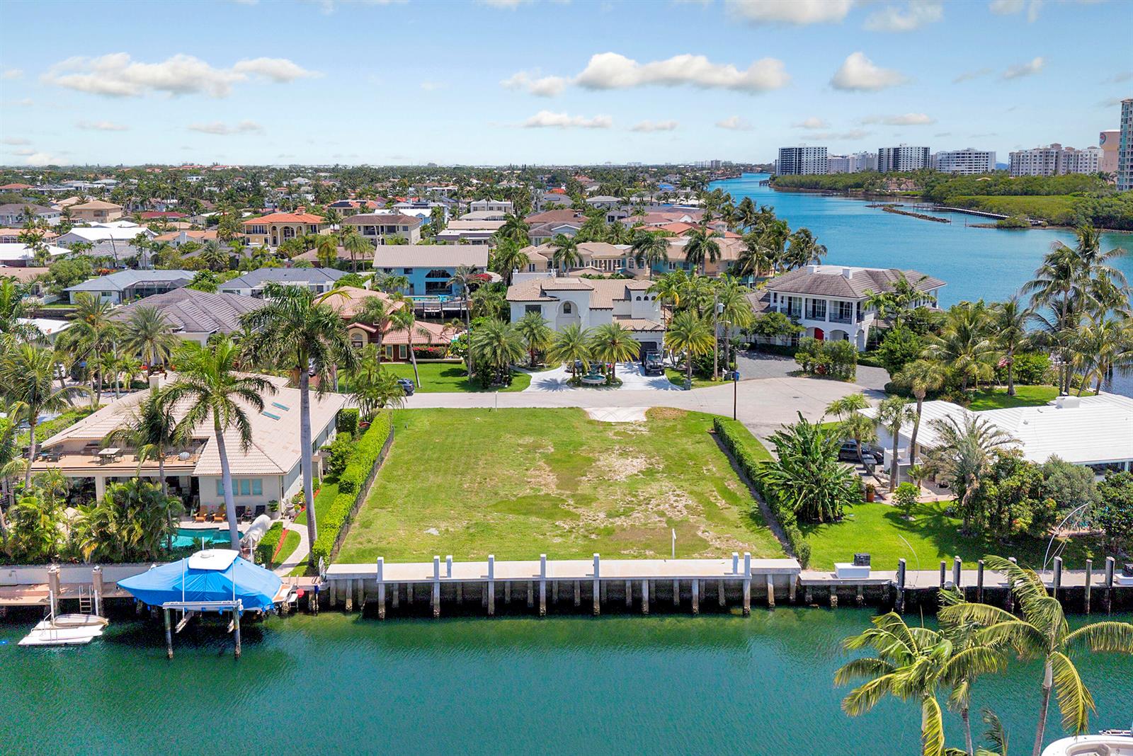 An aerial view shows a vacant waterfront lot with a concrete seawall and boat dock — 876 Forsyth Street, Boca Raton FL 33487, BOCA RATON, FL