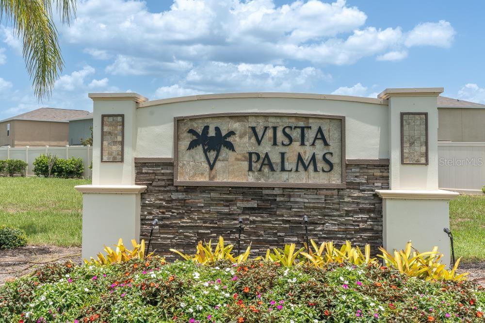 A stone monument sign for Vista Palms stands in front of a landscaped garden — 17010 YELLOW PINE STREET, WIMAUMA, FL