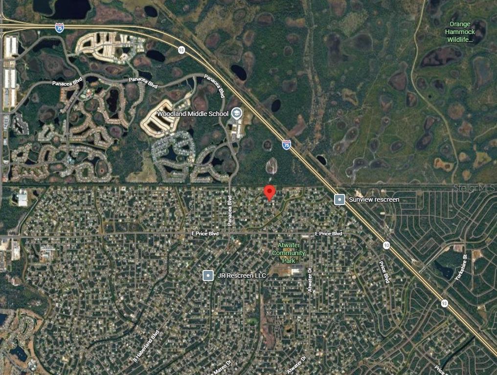 This is an aerial map view of a residential neighborhood near a highway and school — Lot 12 BERTWELL STREET, NORTH PORT, FL