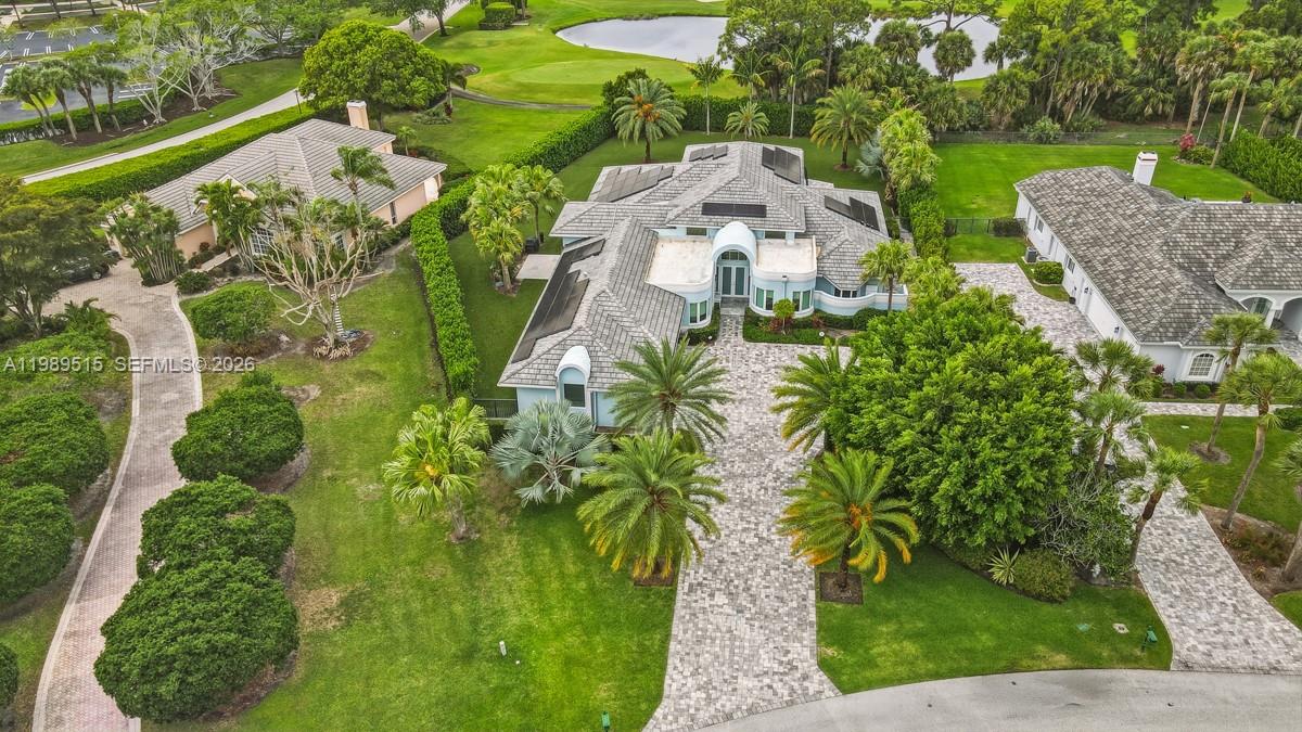 An aerial view shows a large house with a paved driveway and surrounding landscaping — 8179 Lakeview Dr, West Palm Beach FL 33412, WEST PALM BEACH, FL