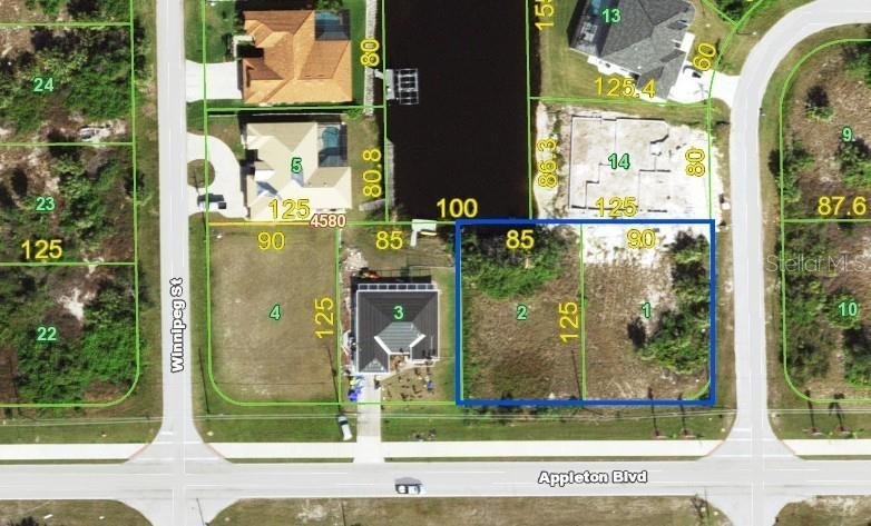 This map shows two adjacent vacant residential lots outlined in blue along a canal — 14062 APPLETON BOULEVARD, PORT CHARLOTTE, FL
