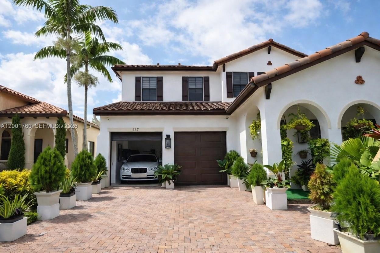 A two-story house with a white stucco exterior, brown tile roof, and a paved driveway — 8537 NW 39th Ct, Cooper City FL 33024, COOPER CITY, FL