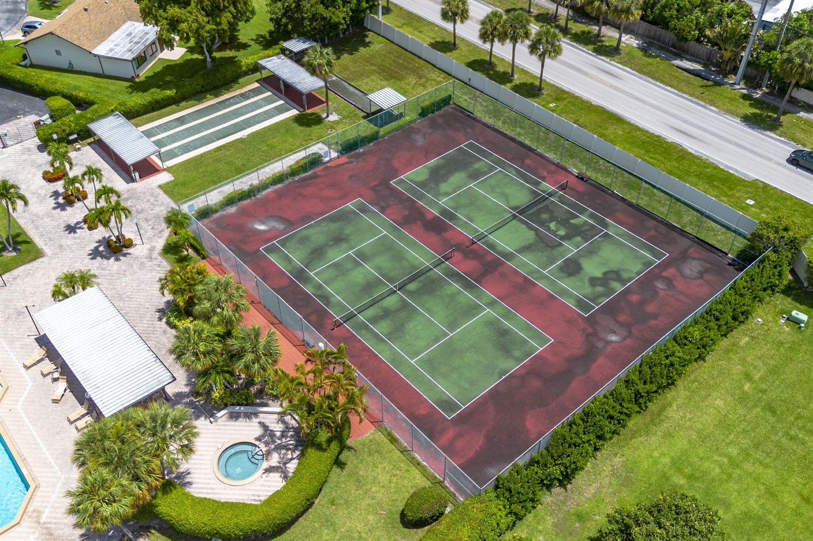 An aerial view shows two tennis courts, a shuffleboard court, and a small circular spa — 6320 Lakemont Circle, FL 33463, FL