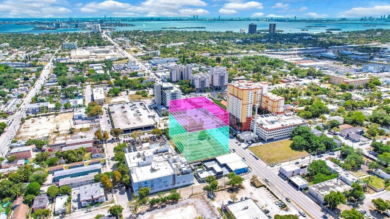 An aerial view shows a vacant lot highlighted with a semi-transparent pink and blue box — 123 NE 79th St, Miami FL 33138, MIAMI, FL