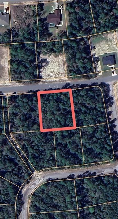 This is an aerial map view of a wooded residential lot outlined in red — 0 SW 33RD TERRACE, OCALA, FL
