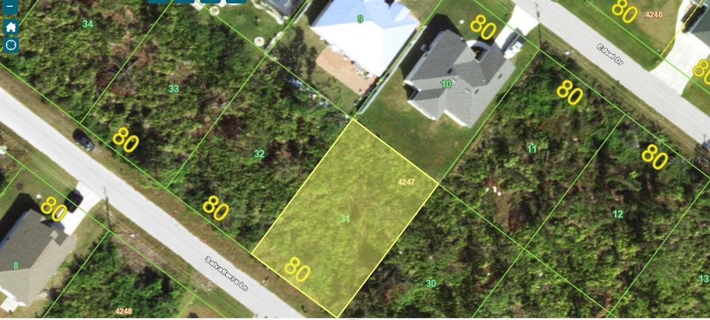 This is an aerial map showing a highlighted vacant residential lot among neighboring properties — 14200 SALVATIERRA LANE, PORT CHARLOTTE, FL