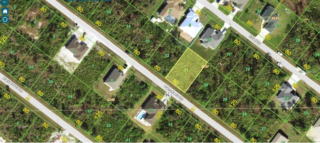 This is an aerial map showing a vacant residential lot highlighted in yellow — 14200 SALVATIERRA LANE, PORT CHARLOTTE, FL